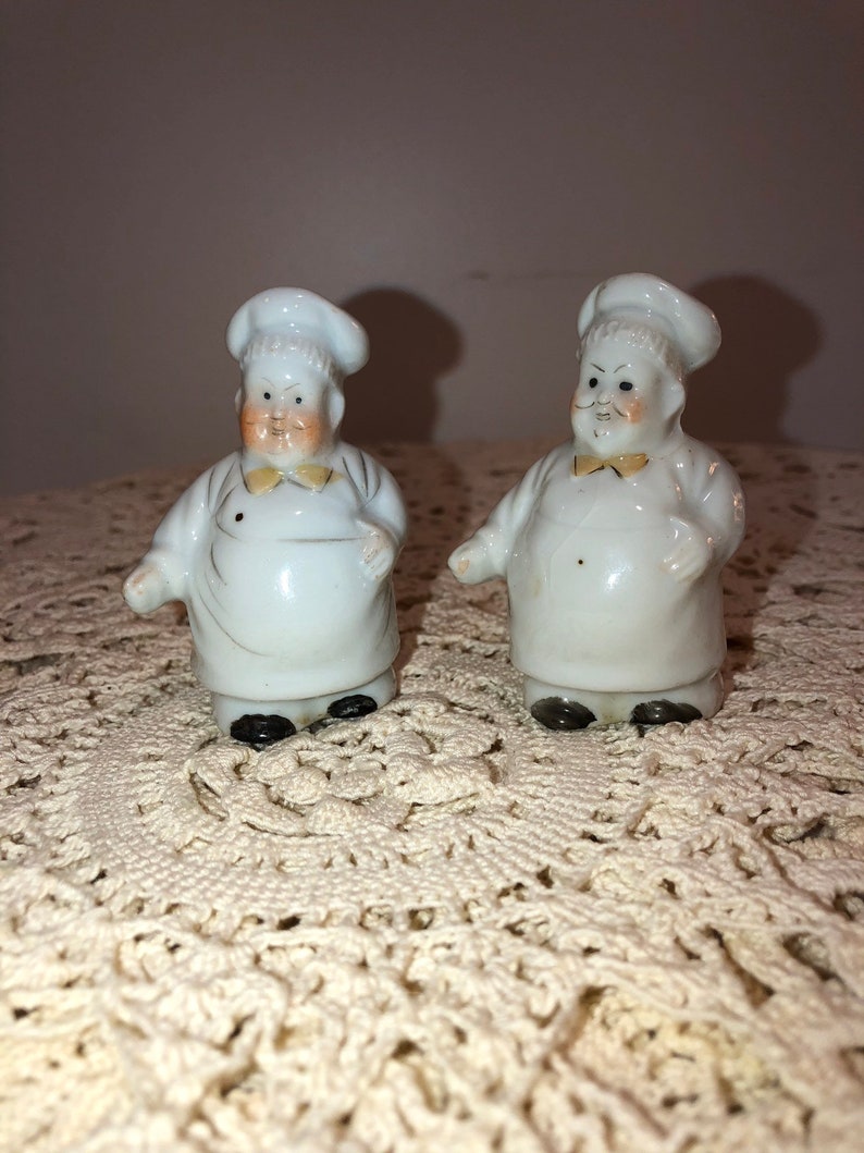 Paint rubbed off in places Chef salt and pepper shakers see pics. vintage Sunshine Crackers bakers salt and pepper set
