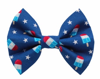 May include: Blue bow tie with a white star and red, white, and blue popsicle pattern.