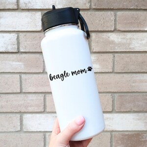Black Beagle Mom decal with a paw print placed on a water bottle.