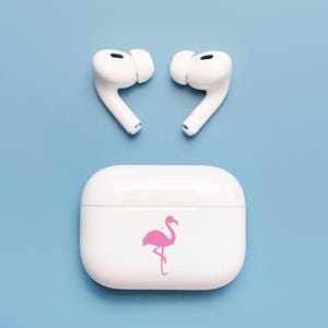 Tiny pink Flamingo decal placed on earphones case.
