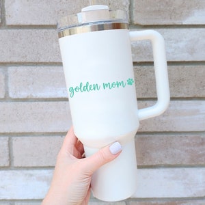 Mint Golden Mom decal with a paw print placed on a tumbler.