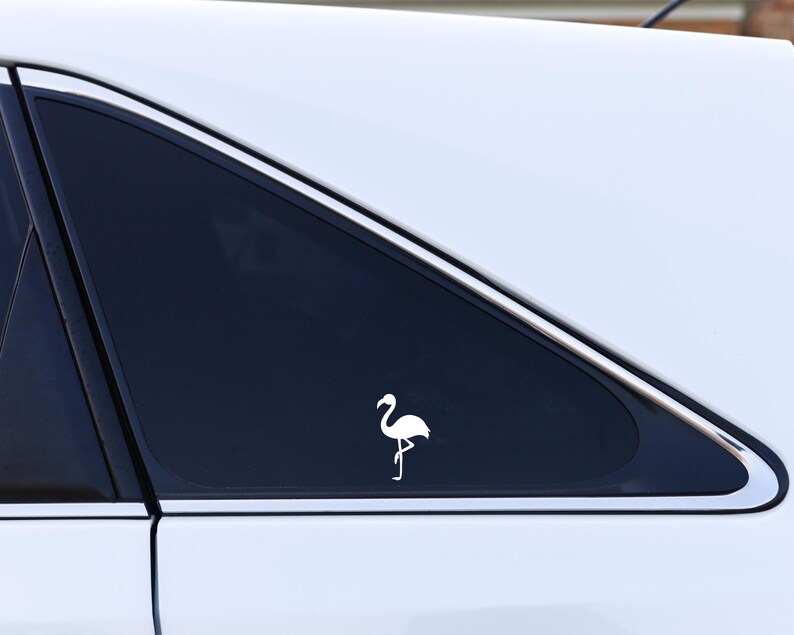 Small Flamingo decal on car window.