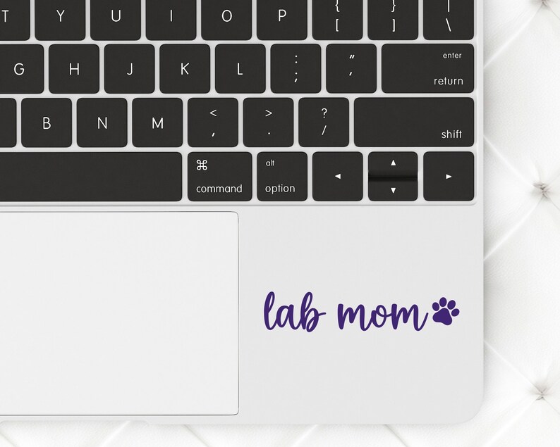 Purple Lab Mom decal with a paw print placed on a laptop.