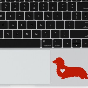 Red Long Haired Dachshund decal with a heart on a laptop.