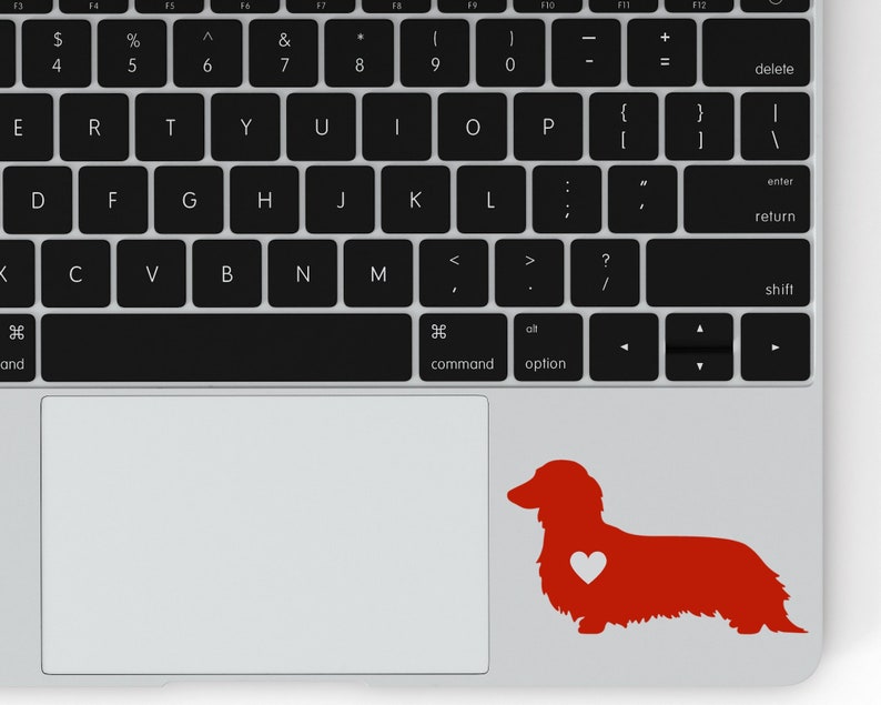 Red Long Haired Dachshund decal with a heart on a laptop.