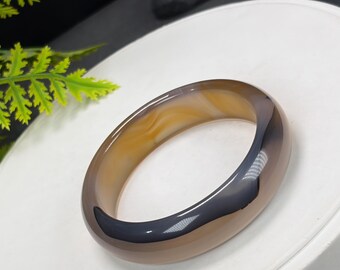 Brazalete de ágata dorada parduzca: 52 mm, gris negruzco translúcido con flor flotante.