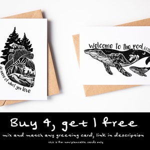 May include: Two greeting cards with kraft paper envelopes. One card features a mountain and forest design with the text "do more of what you love." The other card has a whale design with the text "Welcome to the pod, little one."
