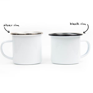 May include: Two white enamel mugs with a simple design. One mug has a silver rim, and the other has a black rim. Both mugs have a white handle and are set against a white background. The mugs are ideal for camping or everyday use.