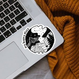 May include: Black and white sticker with a mountain scene and the text "my happy place".