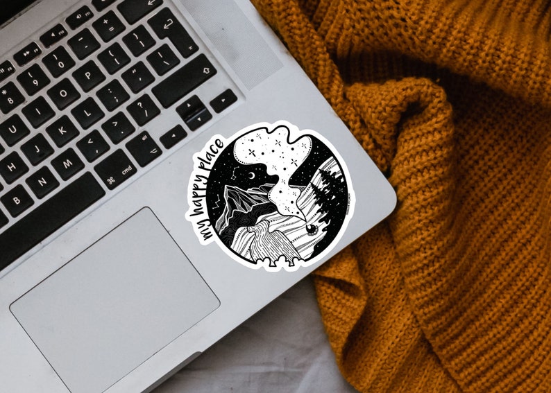 May include: Black and white sticker with a mountain scene and the text "my happy place".