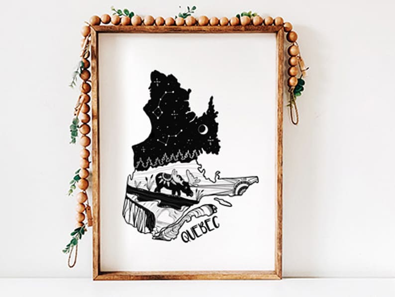 May include: A framed black and white art print featuring the outline of Quebec, Canada. The top portion depicts a starry night sky with constellations, while the bottom shows a landscape with animals. The word "QUEBEC" is written at the bottom.