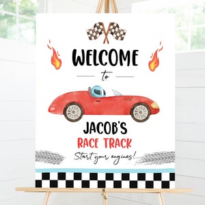 May include: Welcome to Jacob's Race Track sign with a red race car, checkered flag, and tire tracks. Start your engines!