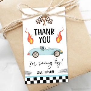 May include: Thank you for racing by!  A blue race car with checkered flags and flames on a white tag with black text.  The tag is tied with twine to a brown gift bag.  Love, Mason.