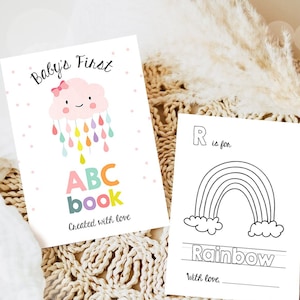 May include: A printable baby's first ABC book with a cute cloud and raindrops illustration. The book cover says "Baby's First ABC book" and "Created with love".