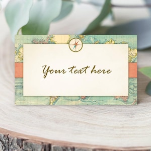 May include: A rectangular place card with a vintage world map design. The card features a cream-colored central panel with the text "Your text here" in brown script, and a compass rose graphic. A coral-colored band accents the design.