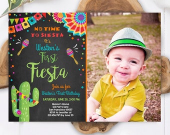 May include: A colorful invitation for a first birthday party with a photo of a baby boy wearing a green and white hat. The invitation has a chalkboard background with the text "No Time to Siesta It's Weston's First Fiesta" and a cactus illustration. The invitation also includes details about the party, including the date, time, location, and RSVP information.