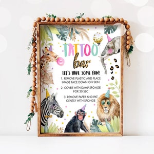 May include: A colorful sign with the words "TATTOO BAR" and instructions for applying temporary tattoos. The sign features a jungle theme with illustrations of a giraffe, elephant, zebra, monkey, and lion.