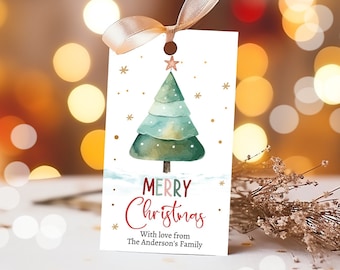 May include: A white gift tag with a watercolor Christmas tree design. The tree is green and blue with a gold star on top. The tag reads "Merry Christmas" in red and green script, with a personalized message below.