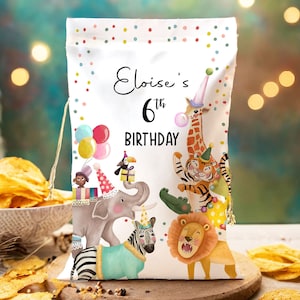 May include: White party favor bag with a colorful confetti pattern. The bag features a cartoon illustration of animals in party hats, including a giraffe, tiger, elephant, zebra, and lion. The text "Eloise's 6th Birthday" is printed on the bag.