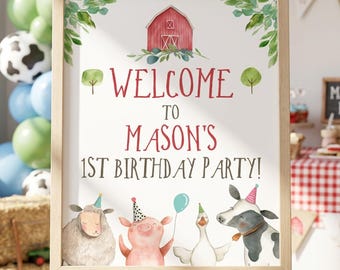 May include: A rectangular sign on a wooden easel featuring a red barn illustration, green foliage, and the text Welcome to Mason's 1st Birthday Party. Below the text are watercolor illustrations of a sheep, pig, goose, and cow wearing party hats.