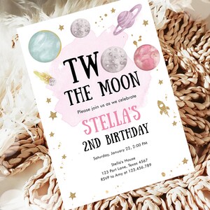 May include: A pink and white invitation with gold glitter stars and planets. The text reads "Two the Moon, Please join us as we celebrate Stella's 2nd Birthday. Saturday, January 22, 2:00 PM, Stella's House, 123 Port Lane, Texas 4567, RSVP to Amy at 123.456.789"