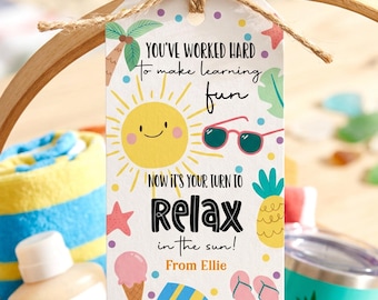 May include: A rectangular white gift tag tied with brown twine, featuring colorful summer illustrations including a smiling sun, sunglasses, a pineapple, ice cream, and flip-flops. The text reads: You've worked hard to make learning fun. Now it's your turn to relax in the sun! From Ellie.