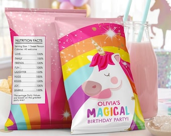 May include: Two rectangular snack bags featuring a pink and rainbow design with a white unicorn illustration. The front bag displays the text Olivia's Magical Birthday Party, while the back bag shows a Nutrition Facts label listing Love, Family, Friends, Fun, Laughter, Hugs, Kisses, Joy, and Sparkle at 100% daily value.