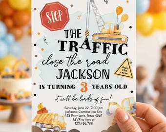 May include: A rectangular birthday invitation card featuring construction-themed illustrations including a crane, a dump truck, and a stop sign. The text reads: STOP THE TRAFFIC close the road JACKSON IS TURNING 3 YEARS OLD it will be loads of fun!