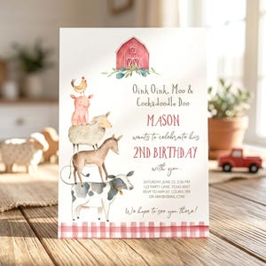 May include: A birthday invitation card featuring a watercolor illustration of a red barn and a stack of farm animals including a cow, donkey, sheep, pig, and chicken. The text reads Oink Oink, Moo & Cockadoodle Doo, MASON wants to celebrate his 2ND BIRTHDAY with you, and includes event details and a red gingham border.