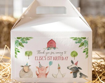 May include: A white cardboard gable box featuring a rectangular label with watercolor illustrations of a red barn, green trees, and farm animals wearing party hats. The text reads: Thank you for coming to ELISE'S 1ST BIRTHDAY.
