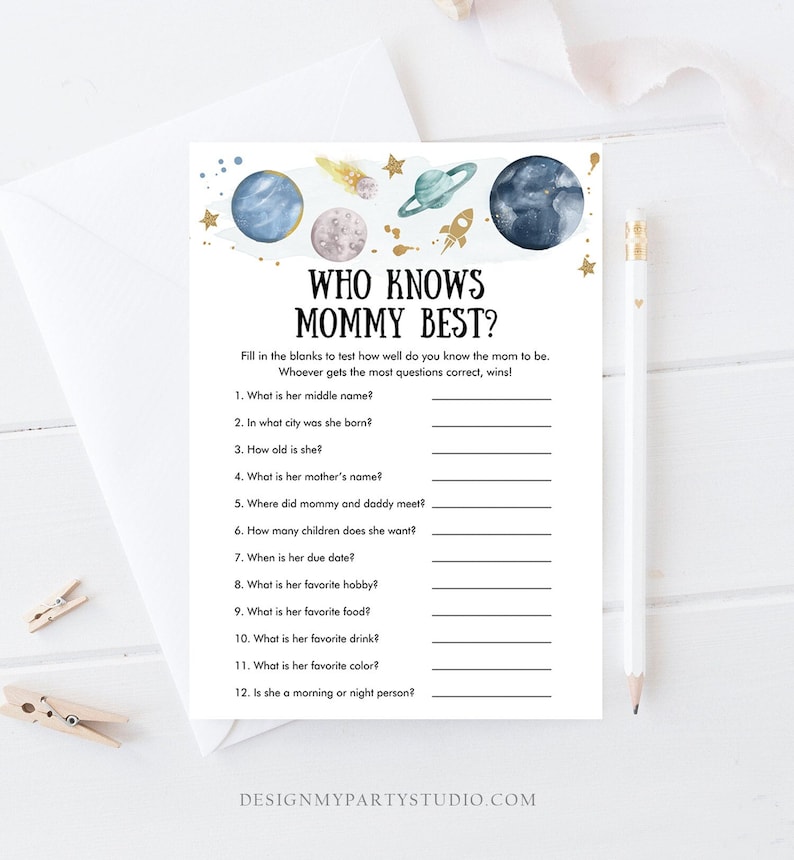 May include: A printable game card with a blue, white, and gold space theme. The text reads "Who Knows Mommy Best?" and includes 12 questions about the mother-to-be.