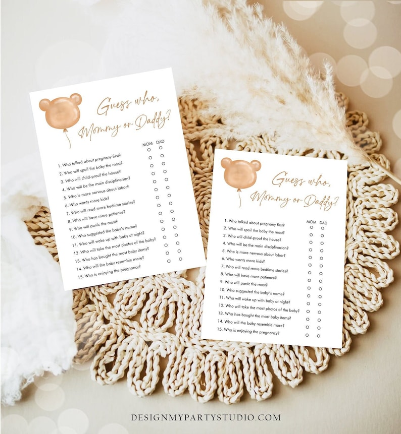 May include: Two printable baby shower game cards with a brown bear balloon graphic. The cards have the text "Guess who, Mommy or Daddy?" and a list of 15 questions about pregnancy and parenting.  Players circle "Mom" or "Dad" to answer each question.