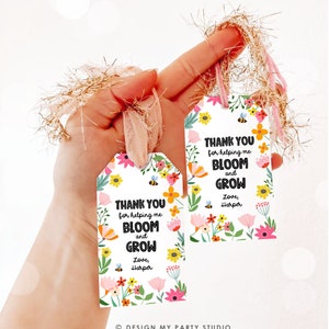 May include: Two white gift tags with a floral design and the text "Thank you for helping me bloom and grow. Love, Harper".
