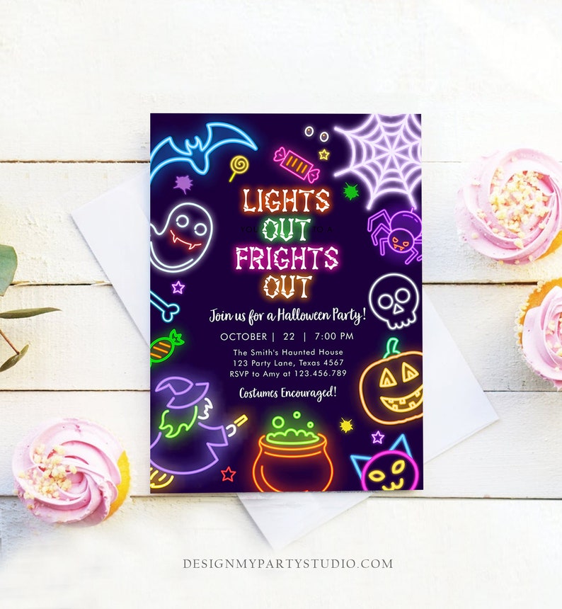 May include: A Halloween party invitation with neon-style illustrations of a bat, ghost, spiderweb, skull, pumpkin, witch, and cat. The invitation reads "LIGHTS OUT FRIGHTS OUT" and includes party details. Two cupcakes with pink frosting are on the right.