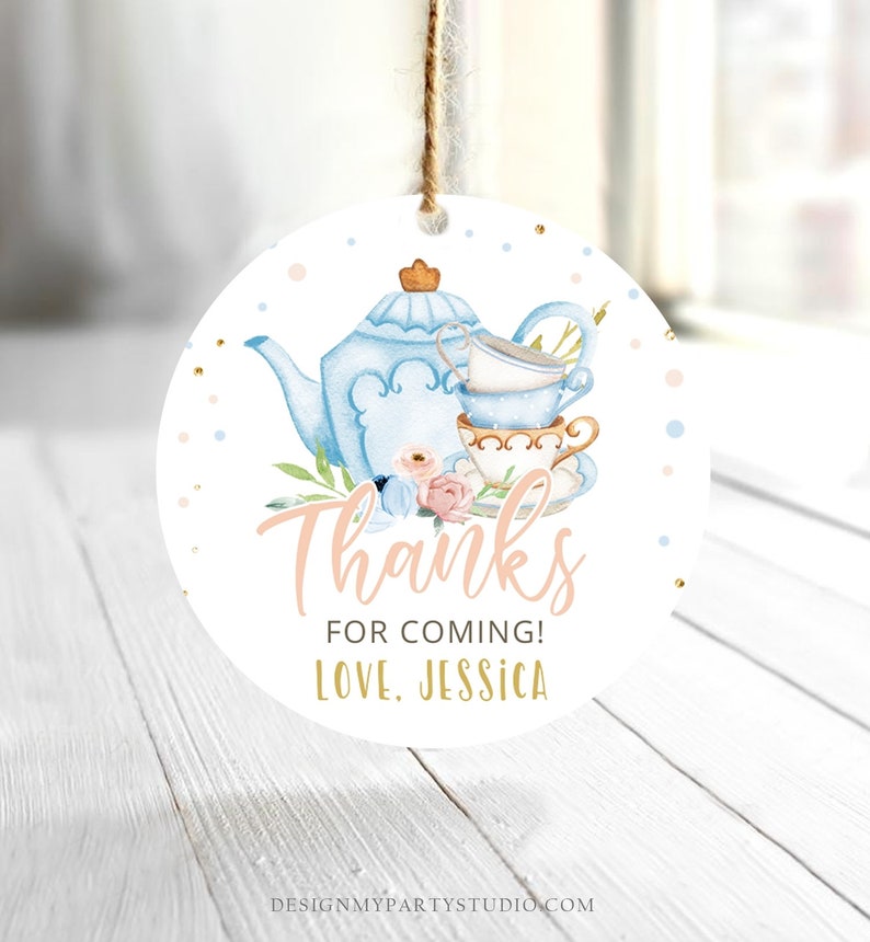 May include: Round white thank you tag with a blue teapot and teacups, pink and blue flowers, and gold glitter. The text reads "Thanks for coming! Love, Jessica".