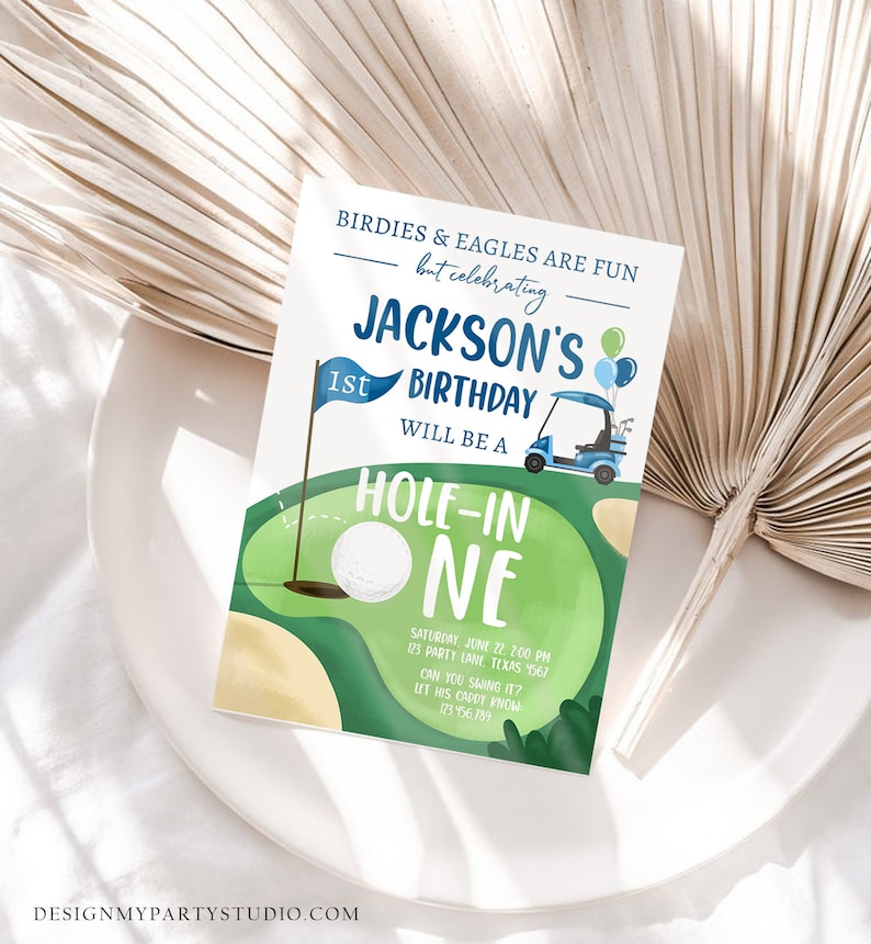 May include: A blue and green golf-themed birthday invitation for a 1st birthday party. The invitation features a golf cart, a golf ball, and the text "Jackson's 1st Birthday Will Be A Hole-In-One".