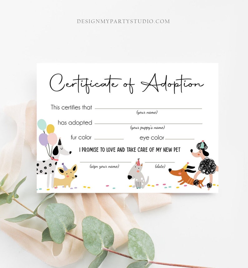 May include: A white "Certificate of Adoption" card with playful dog illustrations. The card includes fill-in-the-blank sections for the adopter's name, puppy's name, fur color, and eye color, with a promise to love and care for the new pet.