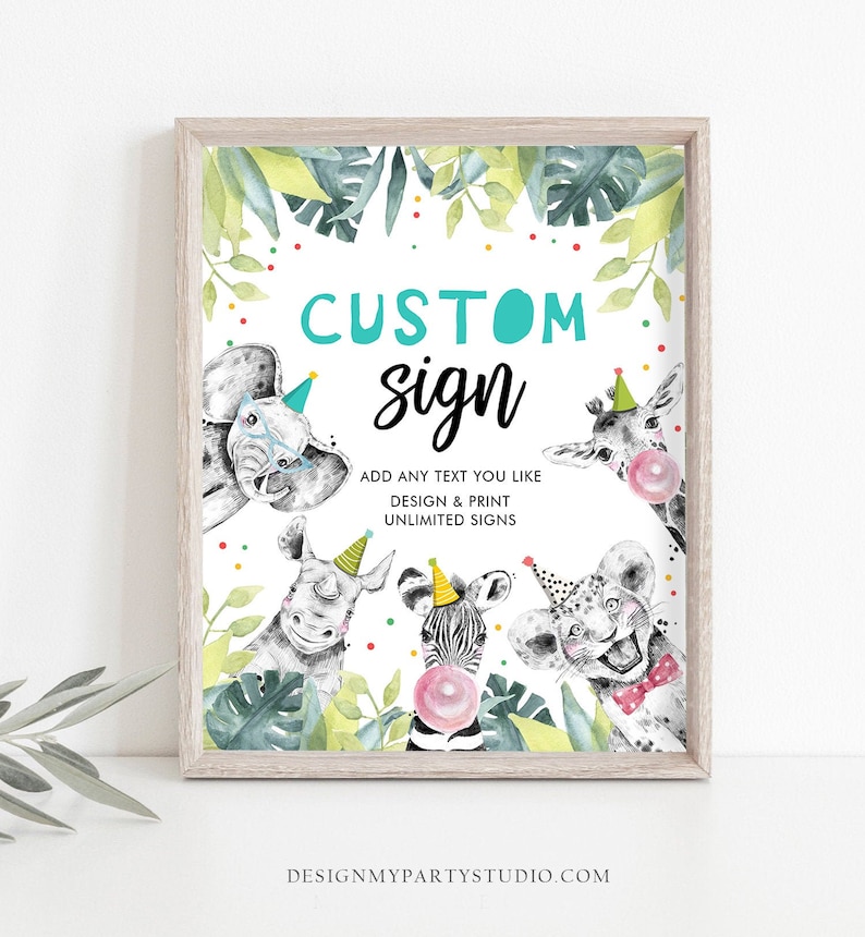 May include: A framed custom sign with a jungle theme. The sign features illustrations of an elephant, rhino, giraffe, zebra, and lion, each wearing a party hat. The text reads "CUSTOM sign" and "ADD ANY TEXT YOU LIKE DESIGN & PRINT UNLIMITED SIGNS".