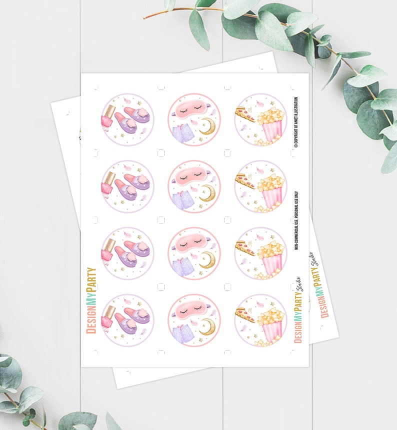 May include: Printable sheet of 12 round stickers featuring illustrations of a sleep mask, slippers, nail polish, and popcorn. The stickers are perfect for a sleepover party.