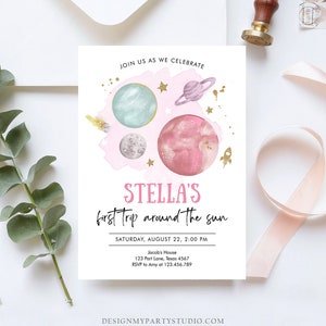 May include: A pink and blue space-themed party invitation with a watercolor background. The invitation says "Stella's first trip around the sun" and includes details for the party, including the date, time, and location.