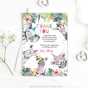 May include: Thank you card with a jungle theme. The card features a colorful thank you message, a pink bubble, and illustrations of a zebra, giraffe, elephant, rhinoceros, and a leopard wearing party hats and glasses. The text on the card reads "Thank You. I enjoyed the cake and the presents too, but my favorite part was seeing you! Thank you for celebrating my birthday with me! Love, Olivia."