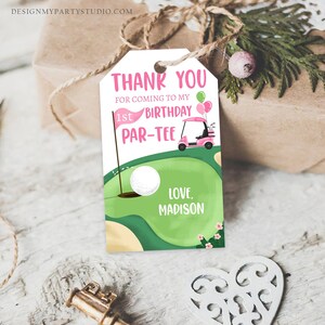 May include: Pink and green thank you tag with a golf cart and golf ball. The text reads "Thank you for coming to my 1st Birthday Par-Tee. Love, Madison."