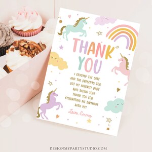 May include: A thank you card with a rainbow, unicorns, and stars. The text reads "Thank You. I enjoyed the cake and the presents too. But my favorite part was seeing you! Thank you for celebrating my birthday with me! Love, Emma."