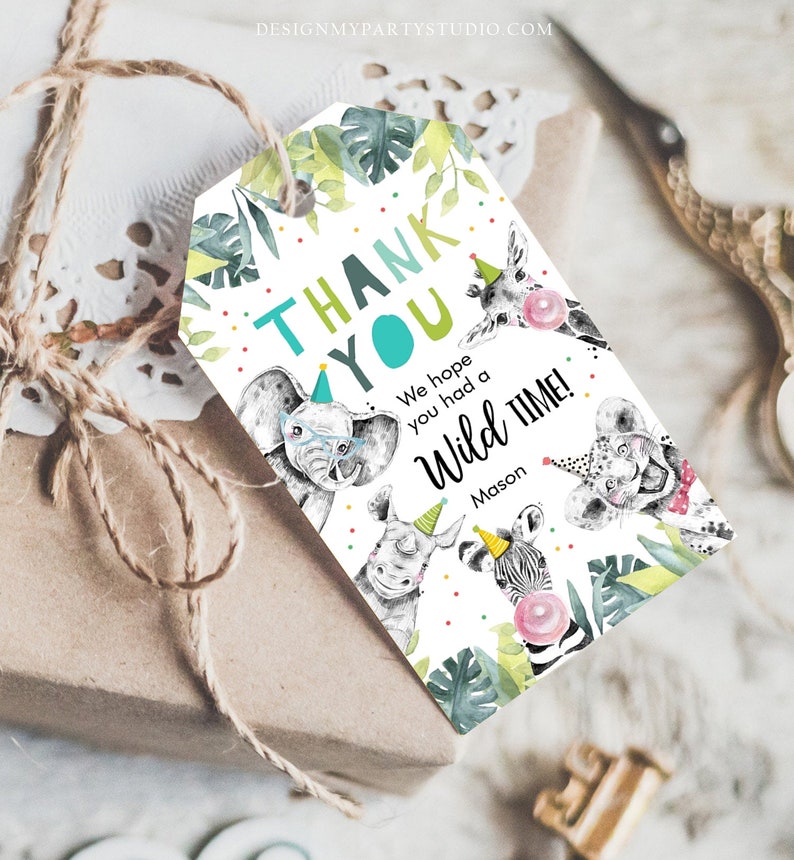 May include: A gift tag with a jungle animal theme. The tag features an elephant, giraffe, rhino, zebra, and leopard, each wearing a party hat. The text reads "THANK YOU" and "We hope you had a Wild Time!"