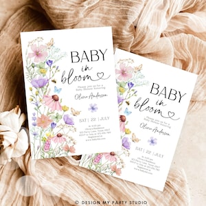 May include: A baby shower invitation with a floral design. The invitation says "Baby in Bloom" and includes the date and time of the shower. The invitation is decorated with watercolor flowers and butterflies.