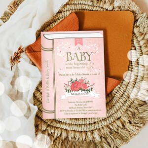 May include: Pink and gold baby shower invitation with a book design. The text reads "A Baby is the beginning of a most beautiful story." The invitation includes the date, time, location, and RSVP information.