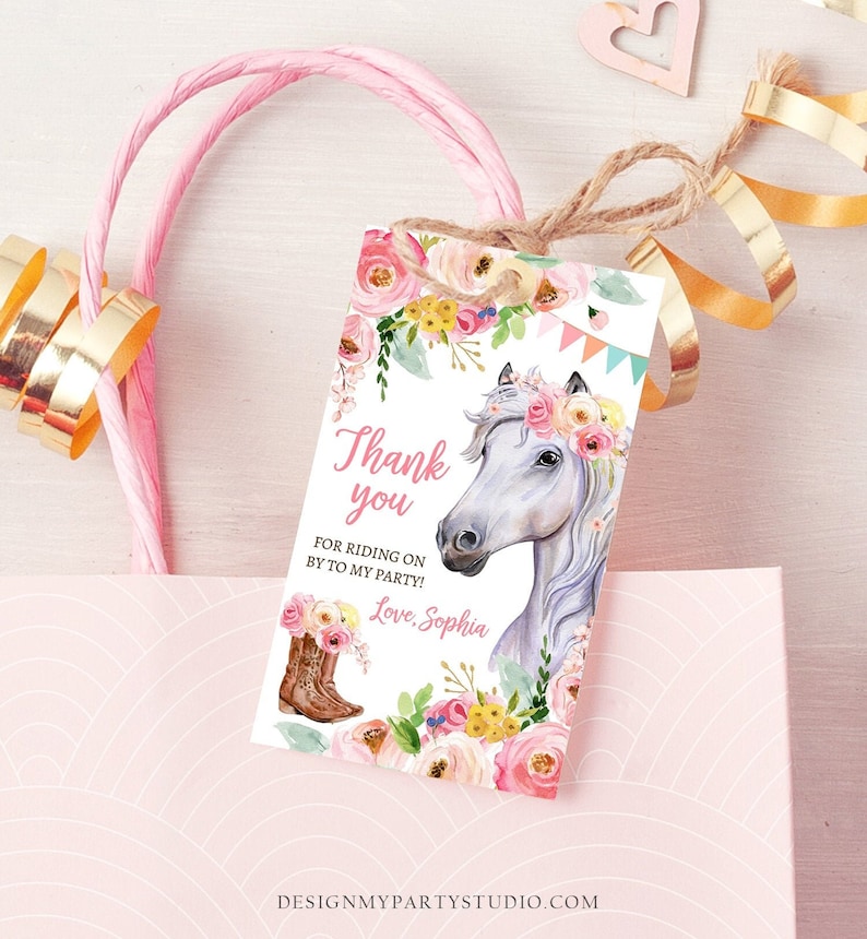 May include: A white thank you tag with a floral design and a white horse with a pink flower crown. The text on the tag reads "Thank you for riding on by to my party! Love, Sophia".