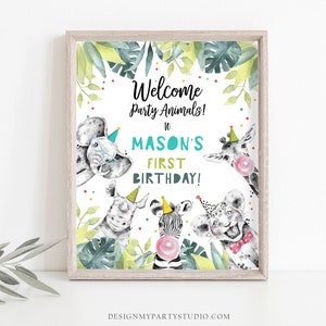 May include: Welcome Party Animals! to Mason's First Birthday! A printable sign with a jungle theme featuring a zebra, giraffe, elephant, rhino, and lion wearing party hats. The background is green with white polka dots.