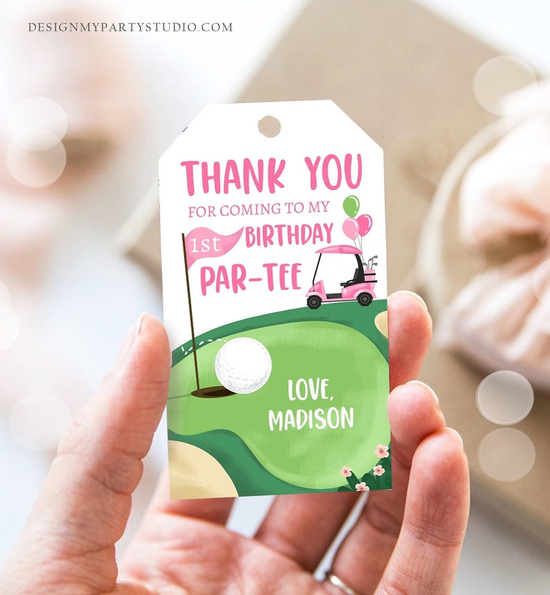 May include: Pink and green thank you tag with a golf cart, golf ball, and the text "Thank you for coming to my 1st Birthday Par-Tee Love, Madison".