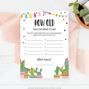 May include: A printable game card with a cactus theme. The card has the title "How Old" and asks players to guess the bride-to-be's age in each photo. The card has a colorful border with tassels and a total correct line at the bottom.